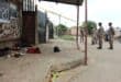 SANDF members standing in front of the tavern. Shoes and other belongings of the deceased and injured were still lying on the stoep. Photo: Adele Louw (Carletonville and Fochville Herald)