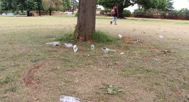 Bottles lying in the park at the circle on Monday morning. Photo: Adele Louw (Carletonville and Fochville Herald)