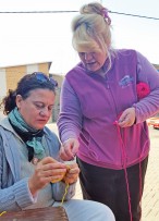 Erika Kooij had no intention of crocheting, but upon seeing all the activity, decided to join in while waiting for her car to be washed. With her is Sparkling Auto’s Marissa, organiser of the knit-a-thon.