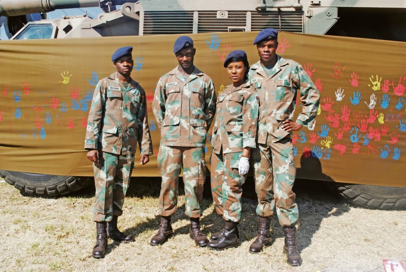 Gunners on hand-painting duty.