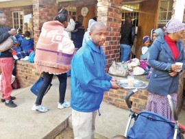 Cllr Small Sehume serves soup at the Thusanong Clinic in Tumahole.