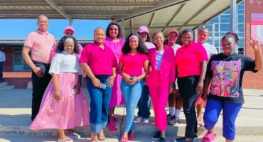 School personnel honoouring Cancer awareness campgaign