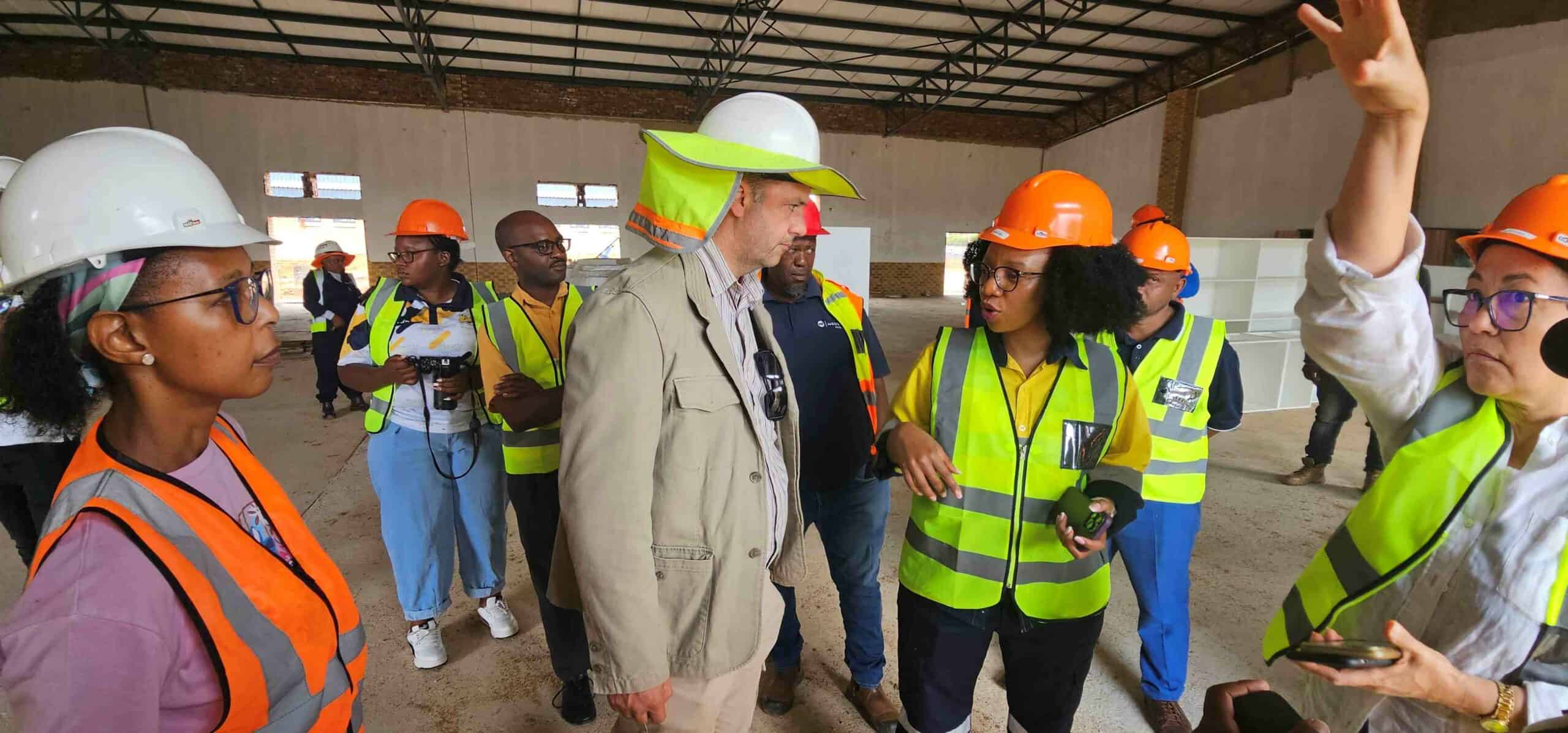 The MEC during the oversight visit inspecting progress made at the multi-functional school hall.