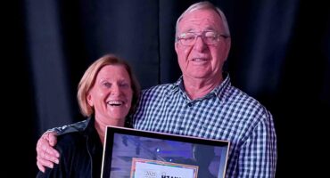 Searle and Lorna Sacks receiving Khaya Lam certificate.