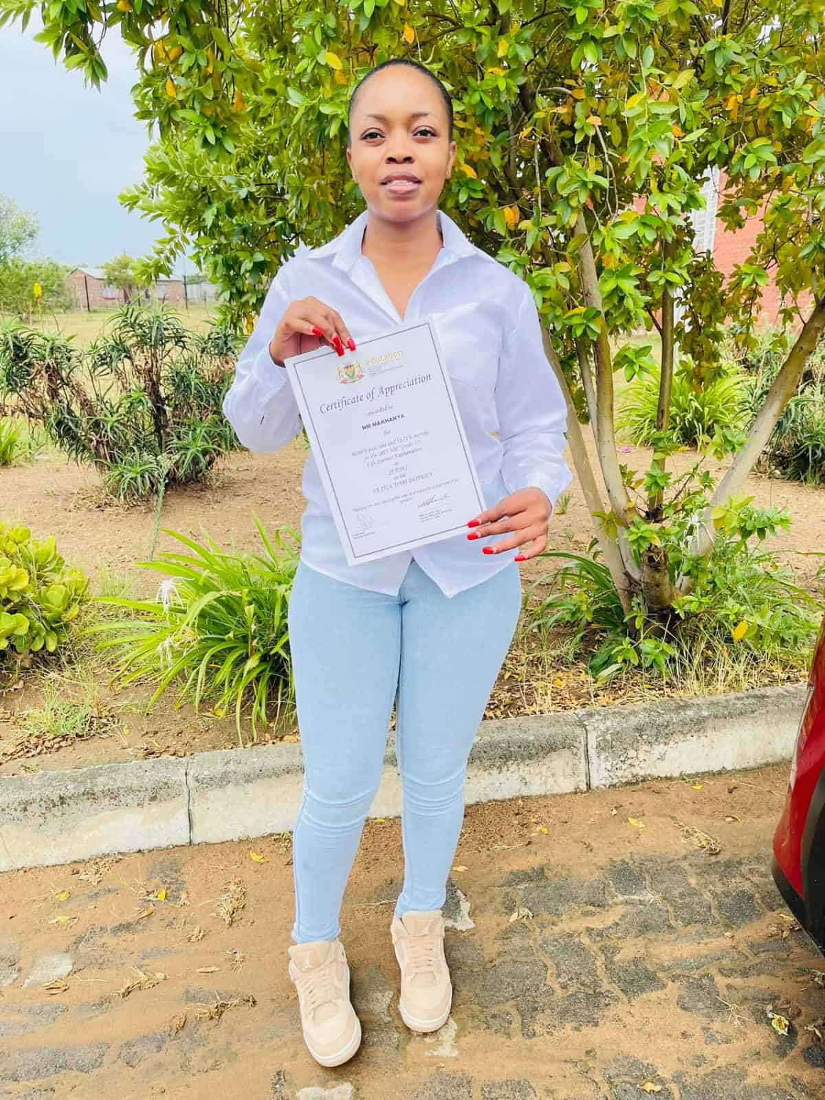Me Makhanya with the certificate she received.