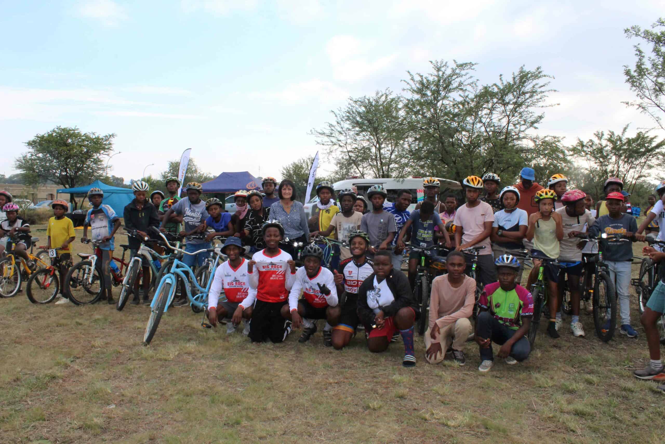 Rotary president Sandra Uys together with cyclists of Big Rock Cycling School who 