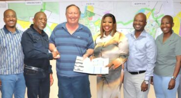 The hand over of the approved building plan for the planned 50-unit luxury hotel. Photo: Supplied by Ngwathe Communication Unit.