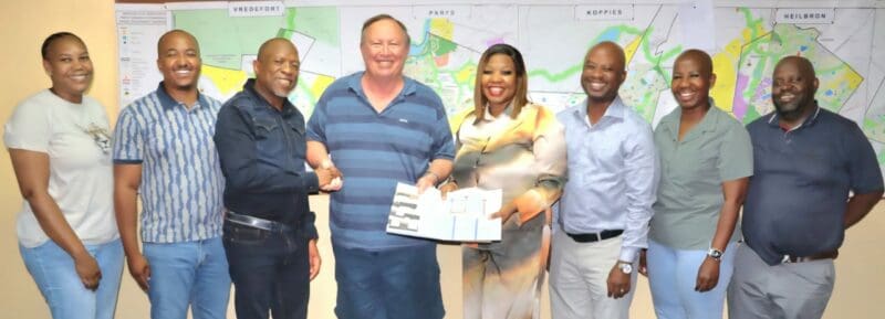 The hand over of the approved building plan for the planned 50-unit luxury hotel. Photo: Supplied by Ngwathe Communication Unit.