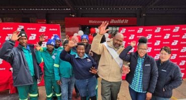 Staff from Pula Build-it celebrating with Paul Maqase, the winner of the Hyundai Grand i10. Photo: Liezl Scheepers