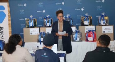 Patience Makhubela, Senior Manager Human Resources Sasolburg and Natref Operations sharing what it means to Sasol employees to have been able to donate school shoes to less fortunate learners themselves. Photo: Sasol