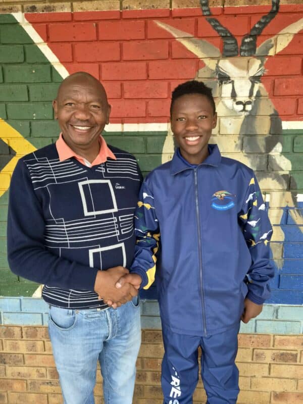 Siyabonga Qiba together with Ntshwephepa's principal, Mr Moloantoa.. Photo: Supplied