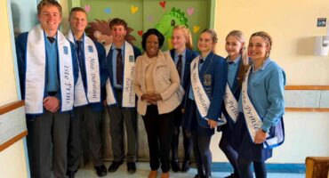 Mrs N. Malinga, CEO of Parys District Hospital, along with some of the winners of this year's Mr. and Miss. High School Parys crowning. in front of the beautifully painted doors of the Paediatric Ward. Photo: Supplied