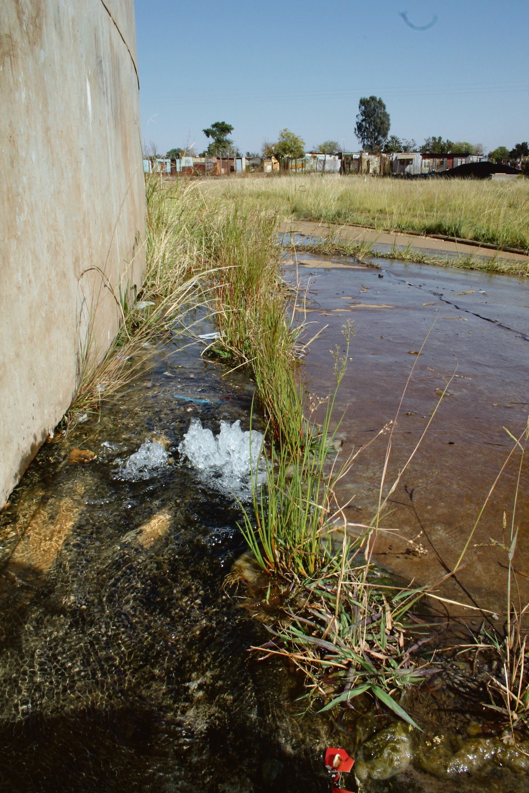 Some of the water streaming from the base of the Khutsong Extension 3 reservoir during the past week.