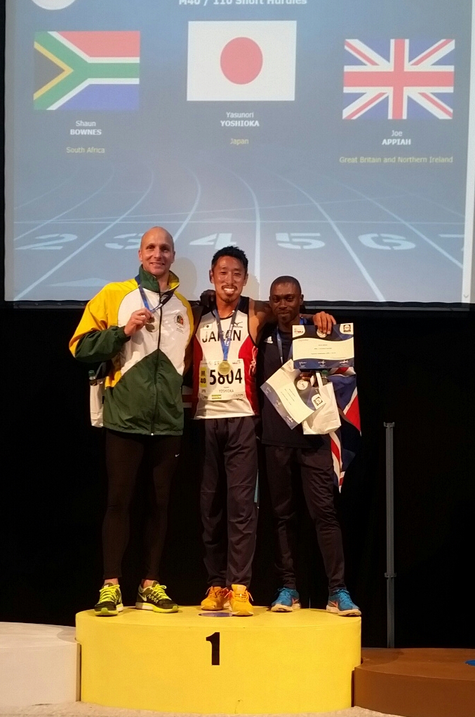 Shaun Bownes on the podium with his silver medal at the World Masters Athletics Championships.