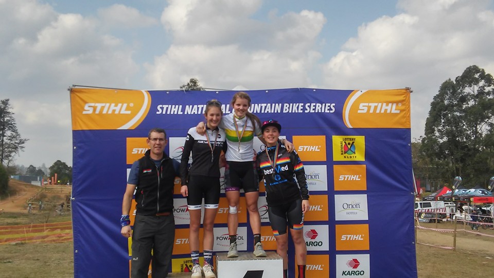 Kristen at the top step of the podium. 