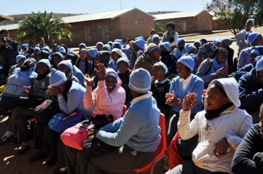 The girls are excited about the gifts they are receiving.