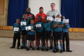 The Cobras were the winning team in Potch Primary's second annual Mini Cricket Tournament. In the back row are Rico Ramokhethi (KFC Mini Cricket coordinator in North West), Zaid Mahomed (coach) and Mr Willie de Villiers (principal of Potch Primary