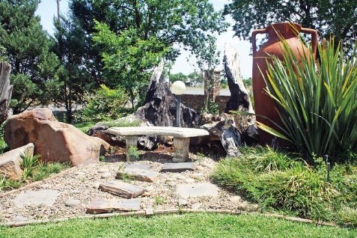 The gardeners use rocks and tree trunks and reshape them to decorate the garden. Photos: Selogile Leshage