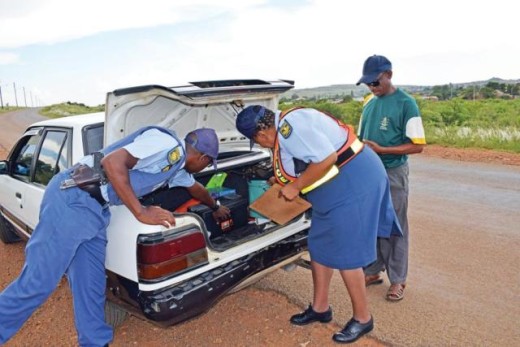 Const. Moeketsi Mosiane and Sgt. Dikeledi Mokotedi search the boot for drugs.