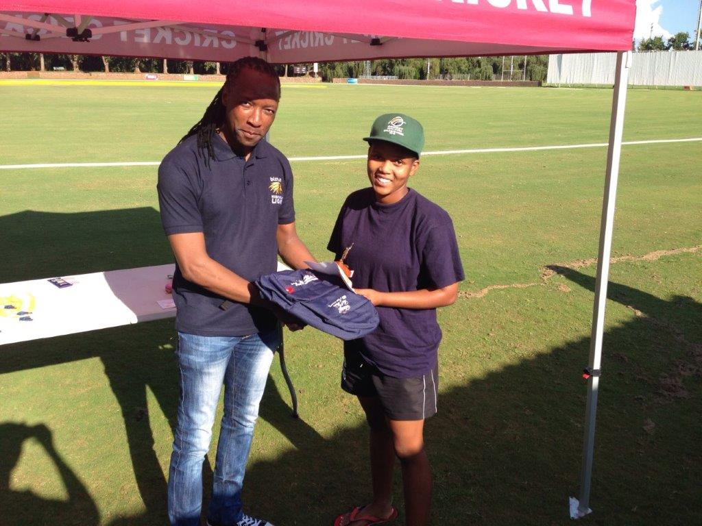 North West Cricket president, Oupa Nkagisang with the bowler of the match, Evodia Yekile.