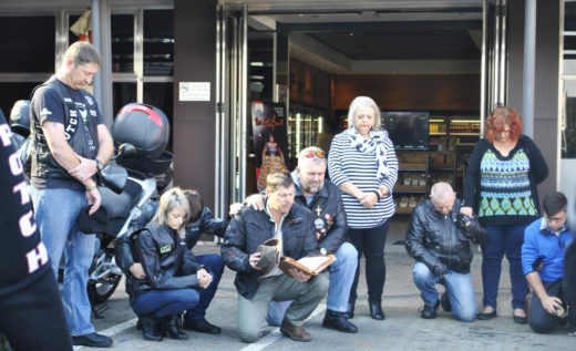 The bikers are starting the day in prayer. Photo: Cadesia de Bruin