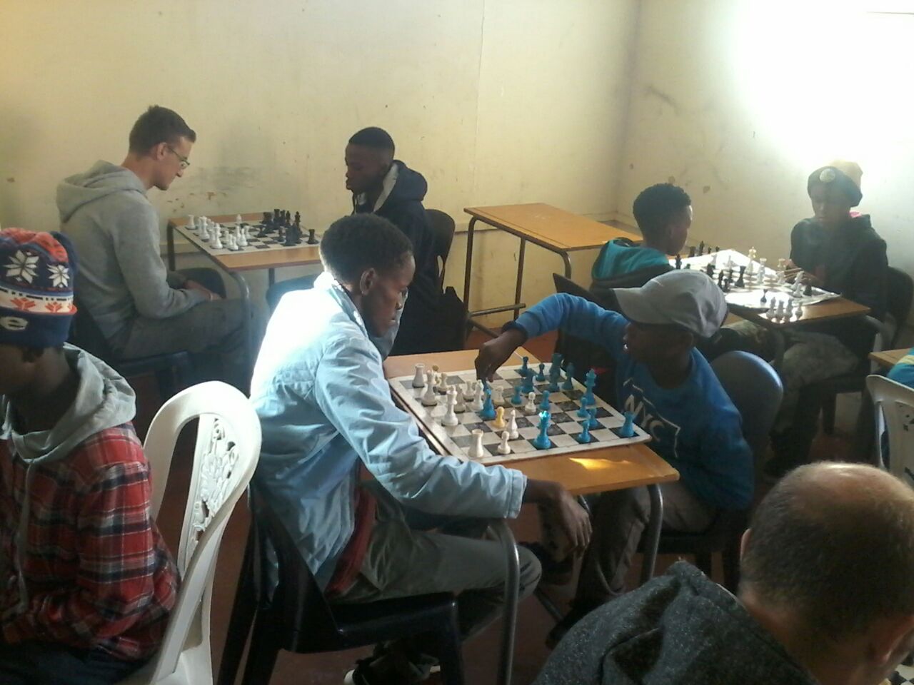 Chess players making their moves during the tournament.