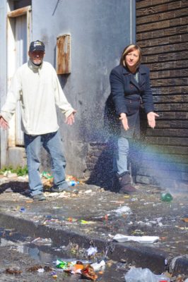 Die opsigter van Design Square, Deon Coetzee en eienaar van North West Refrigeration and Electrical, Anne-Marie Botha,by die water en gemors in die straat. Foto: Marianke Saayman