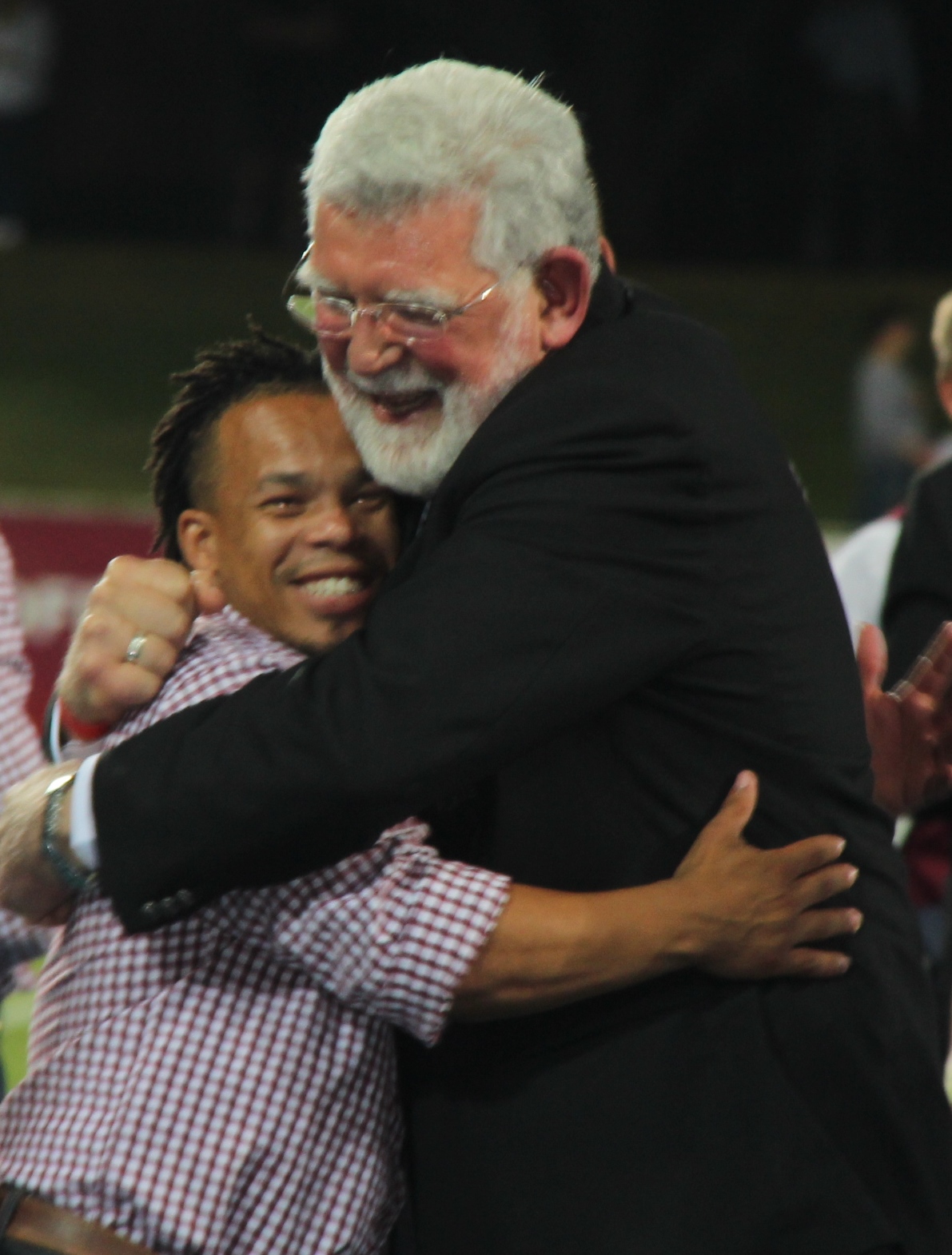 rof. Fika Janse van Rensburg is always in the thick of the action at sports events. Here, he gives a hug to Percy Williams during the Pukke's 2016 Varsity Cup triumph. Photo: Wouter Pienaar