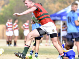 Sewes Rugby in Potchefstroom op Gimnasium se sportgronde,waar Hoerskole vanoor die land kom meeding het aan die Sewe's toornooi.Skole sover as Sutherland en Gauteng het kom deelneem.Die Luiperds se DeWet Botha "stap doellyn "toe met die skrumskakel Tobie Schoeman van Lichtenburg wat probeer keer.Luiperds wen 20-0.foto Mario van de Wall