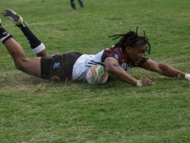 Lungelo Gosa flies over the try line for the NWU. Photo: ASEM Engage/Varsity Sports