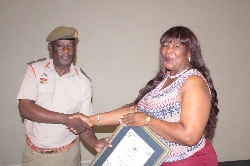 PMSC Sportswoman of the Year – S Sgt Sega Mokoto receives her award from Col Charlie Moralo.