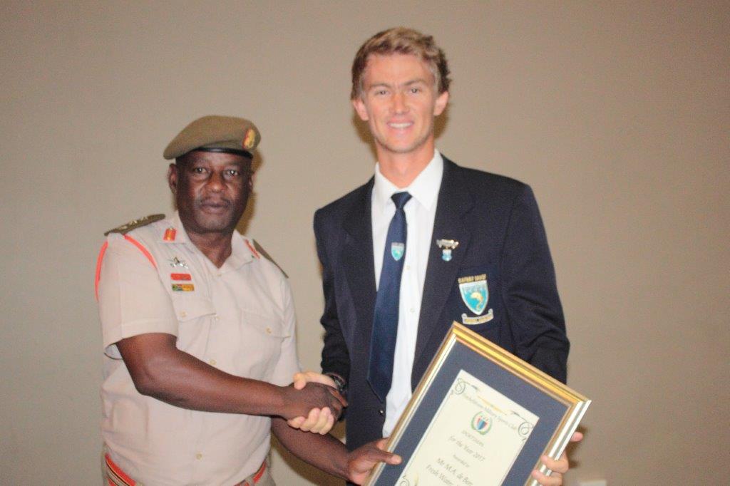 Mr Michael De Beer – Sportsman of the Year receives his award from Col Charlie Moralo.