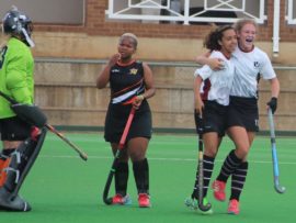 Badrunnisaa Halliday and Elmien Marais celebrate the former's goal as the UJ ladies contemplate defeat. Photos: Wouter Pienaar