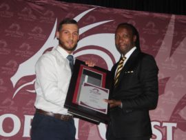 Janneman Malan receives his player of the year award from North West President, Dr. Oupa Nkagisang