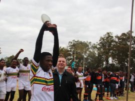 THS first team captain, Ntantla Myeko raises the Clssic Clash trophy