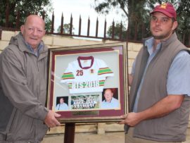 Mr. Chris de Villiers, principal of THS Potchefstroom receives his official 25 year commemorative portrait.