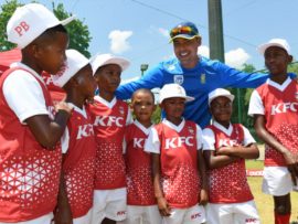 Justin Ontong with the KFC Mini-Cricket Kids from Amstelhof PSS