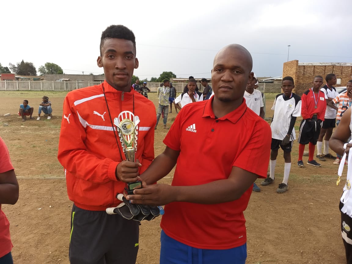 The coach of the tournament, Lefa Mohapi (Bokone Football Club) with SAFA’s regional vice-president, Sandile Boko
