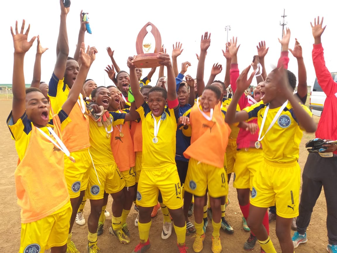 Bokone Football Club lifts the Kenneth Kaunda SAFA regional u.17 tournament trophy.