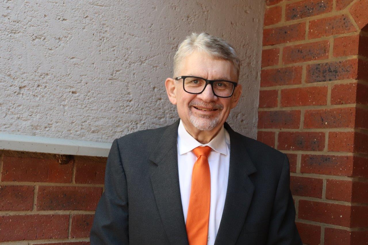 Adv. André May
