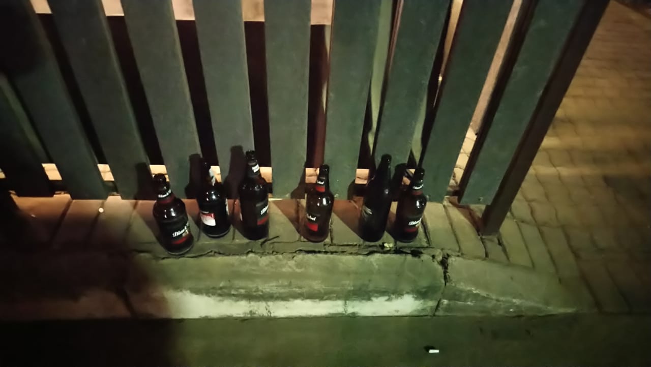 Empty beer bottles were found on the other side of the fence where the friends were sitting. Photos: Provided