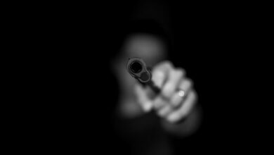 max-kleinen-ugdKmhDg1m8-unsplash gun hijack criminal