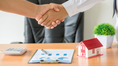 hands of agent and client shaking hands after signed contract bu