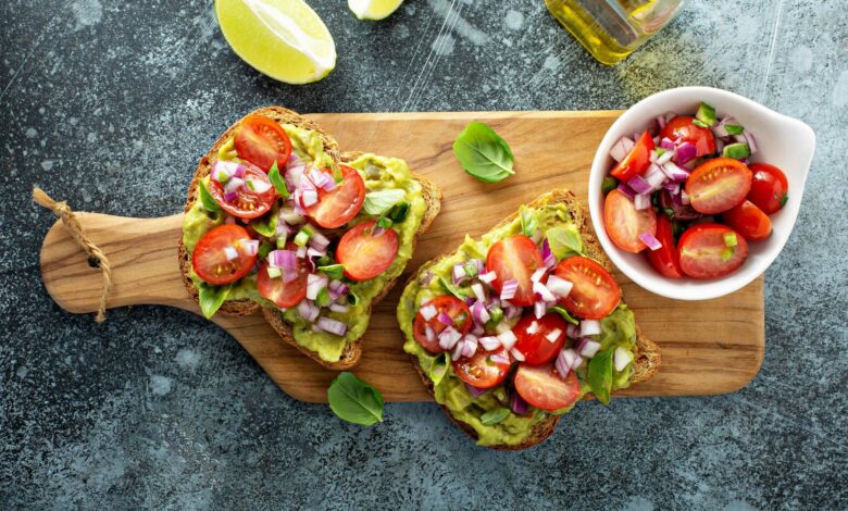 Fresh guacamole and tomato sandwich spread