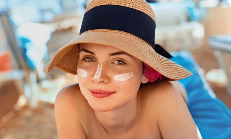 Woman,Smile,Applying,Sun,Cream,On,Face.,Skincare.,Body,Sun