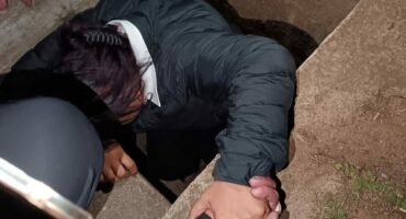 Woman stuck in storm water drain