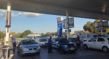 Cars filling up on petrol.