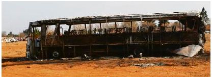 The Mqibelo transport bus that was set alight by the community of Rus-ter-Vaal outside the cemetery over the weekend.