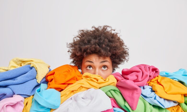 Wondered,Curly,Haired,Ethnic,Woman,Focused,Above,Surrounded,By,Multicolored