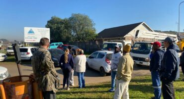 Leehof residents barricade the gate of the ELM electrical department.